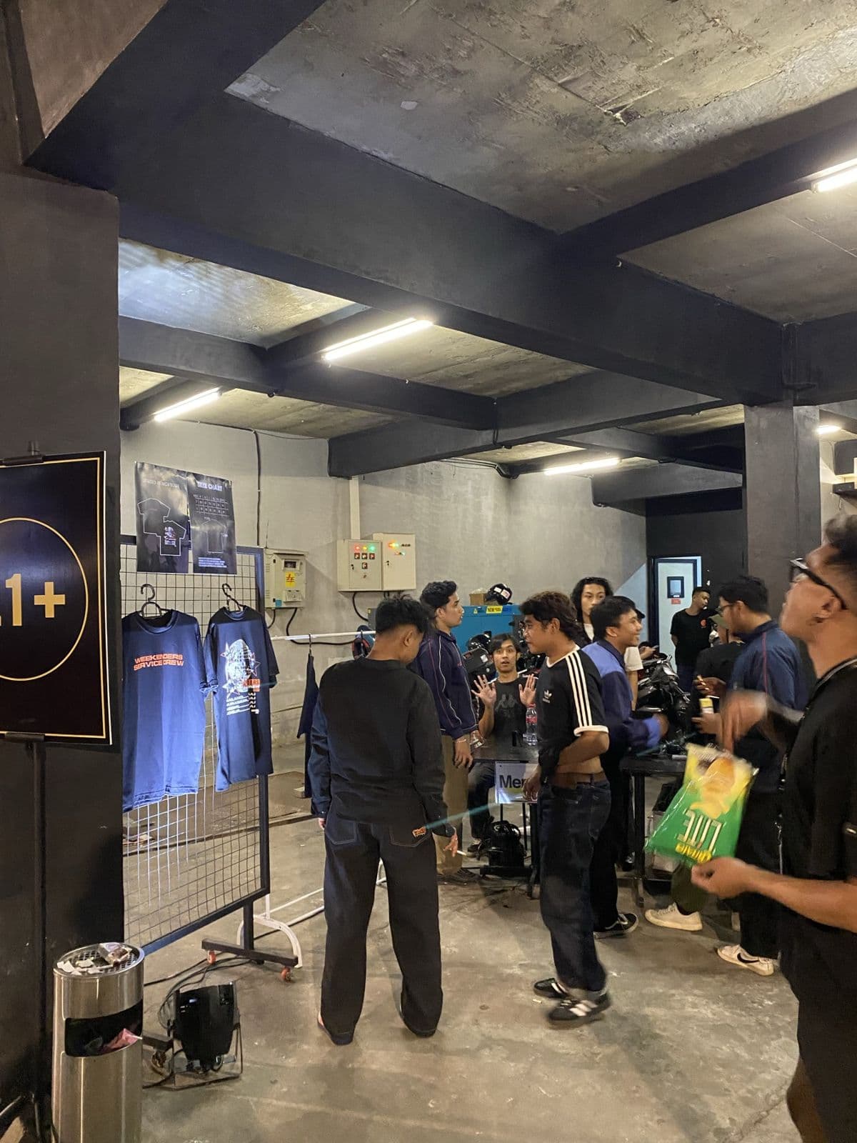 Merchandise stand and queue at a venue entrance