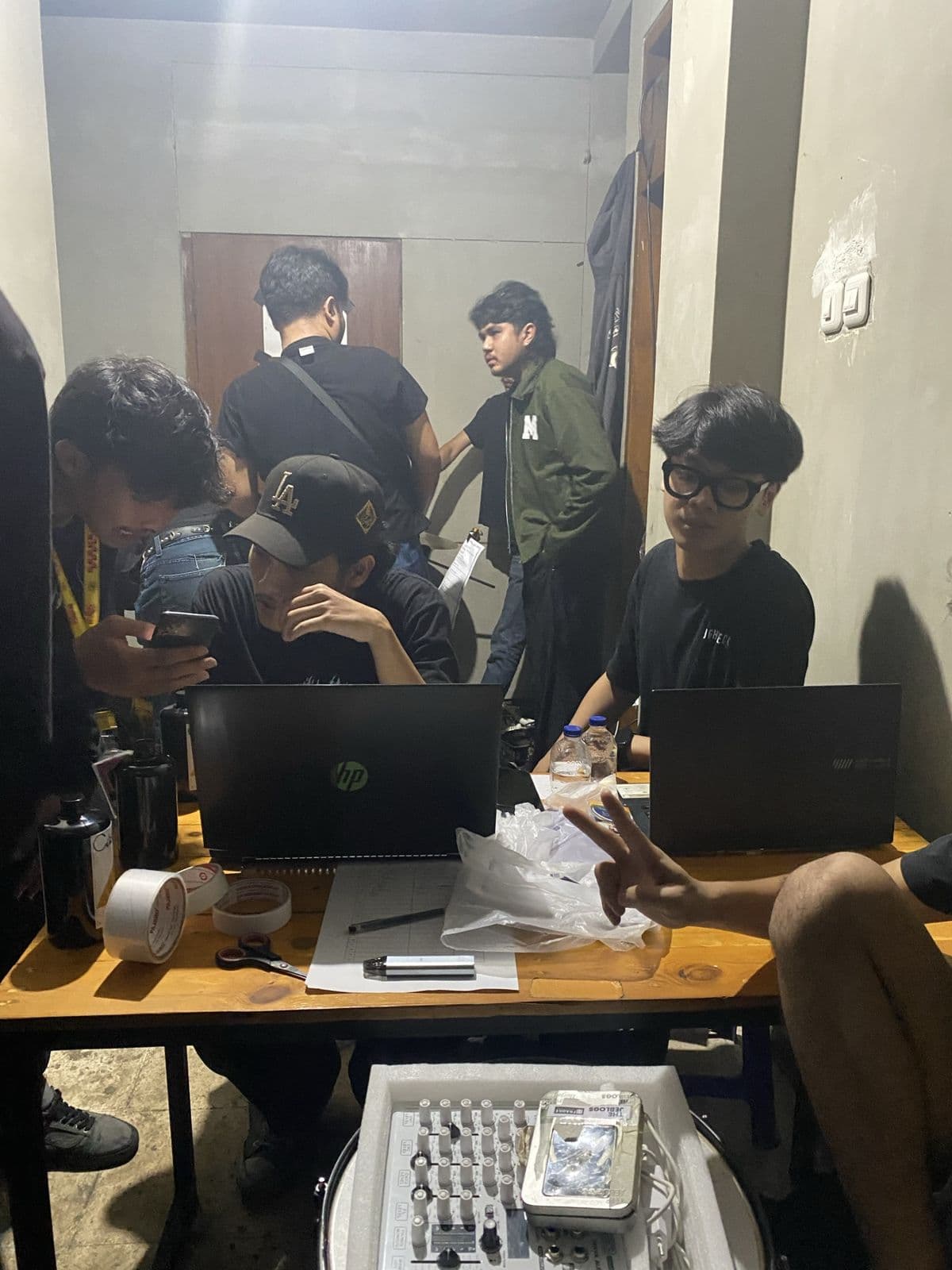 Crew setting up check-in laptops before doors open