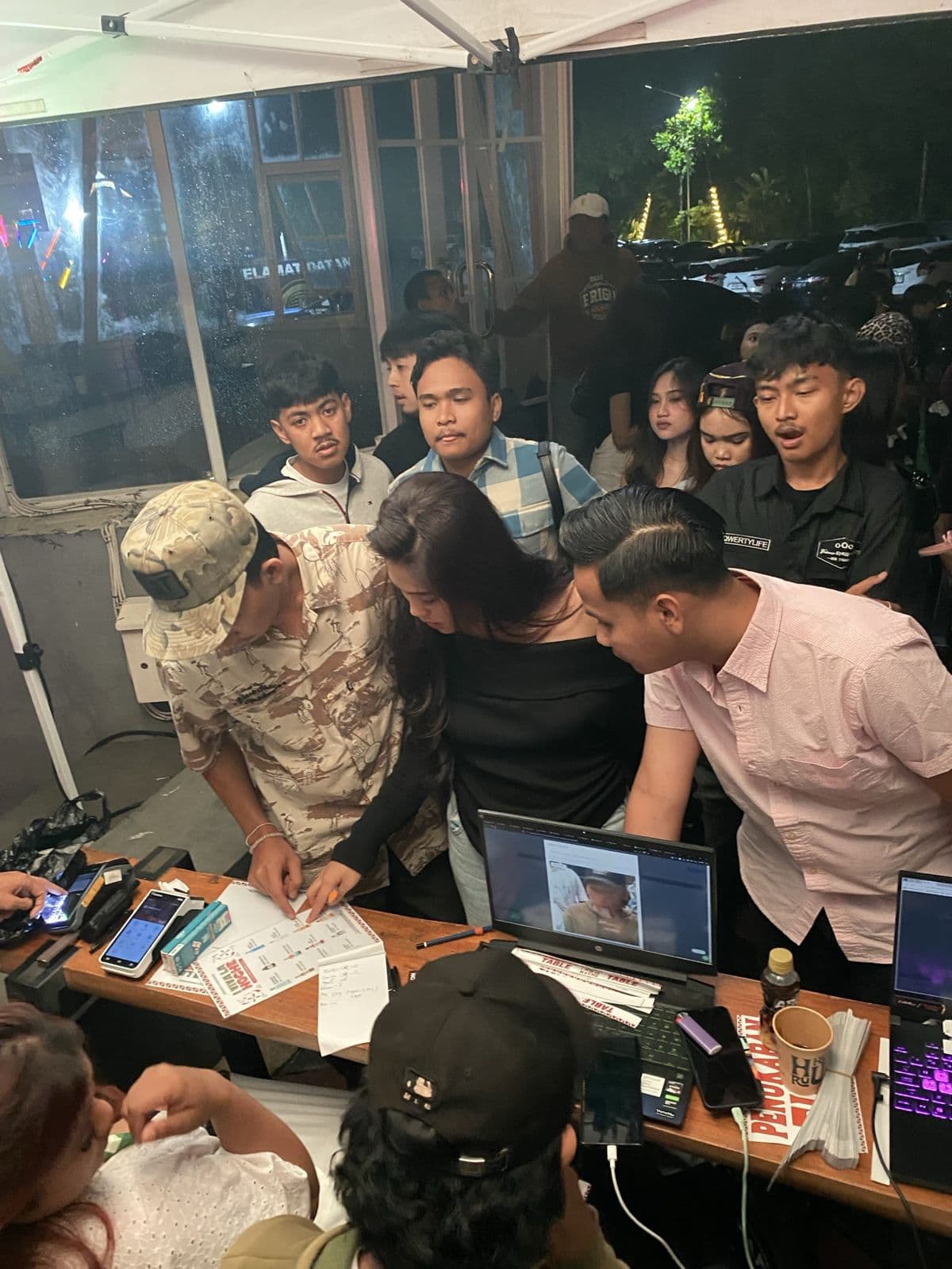 Organizers checking guests in at a VOX PASS ticket desk