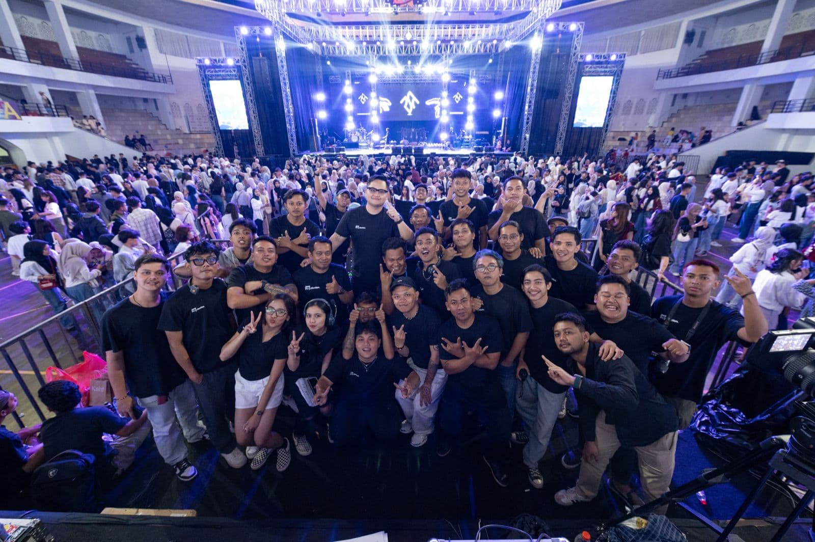 VOX PASS crew in front of a packed concert crowd